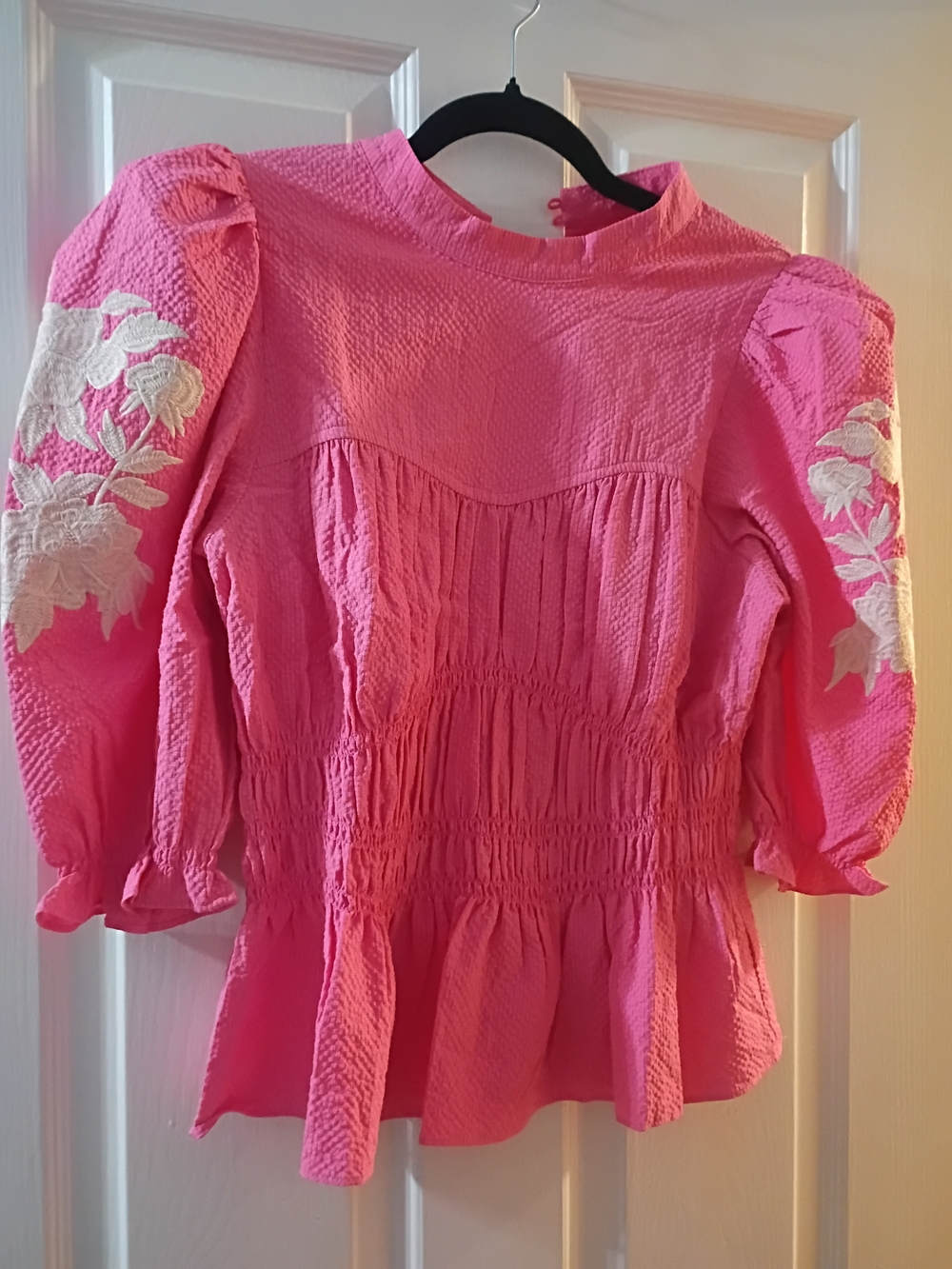 Umgee Hot Pink Smocked Peplum Blouse with White Floral Sleeve Embroidery